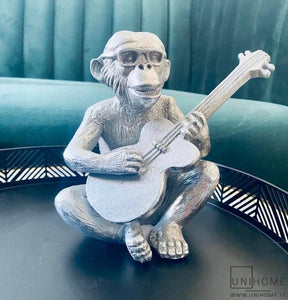 dekoracija beždžionė su gitara